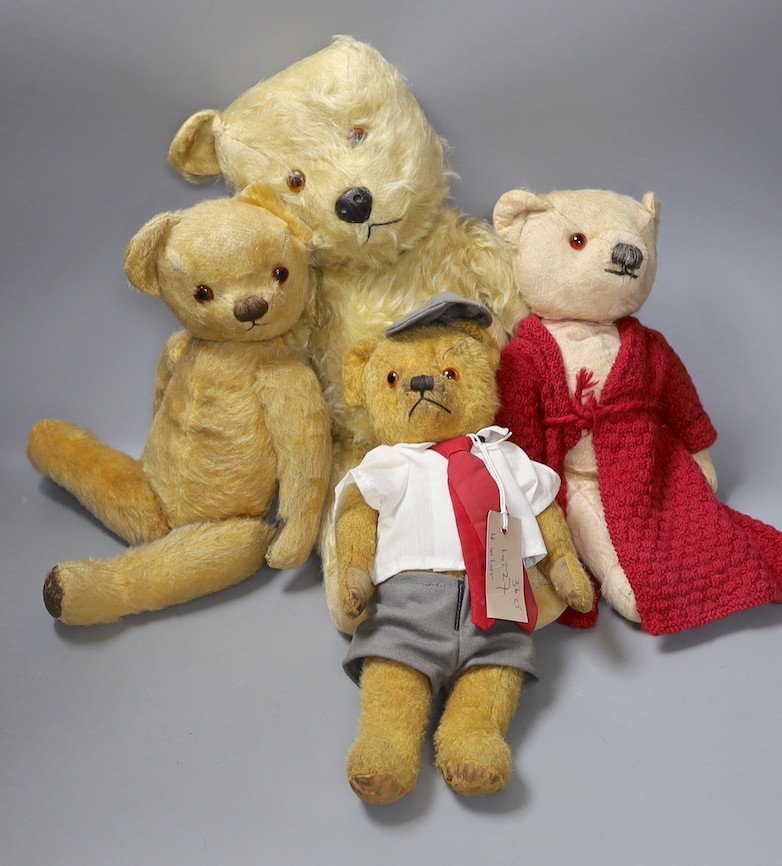 Chiltern Hugmee 1960's, 53cm, a Chadvalley 1950's, 43cm, also a Chadvalley, red gown, 35cm, and an English bear dressed as a schoolboy, 35cm.